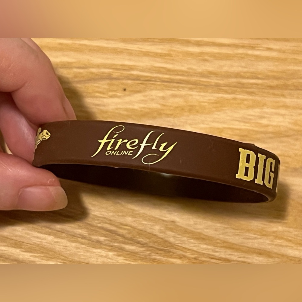 NWOT FIREFLY SILICONE BRACELET.